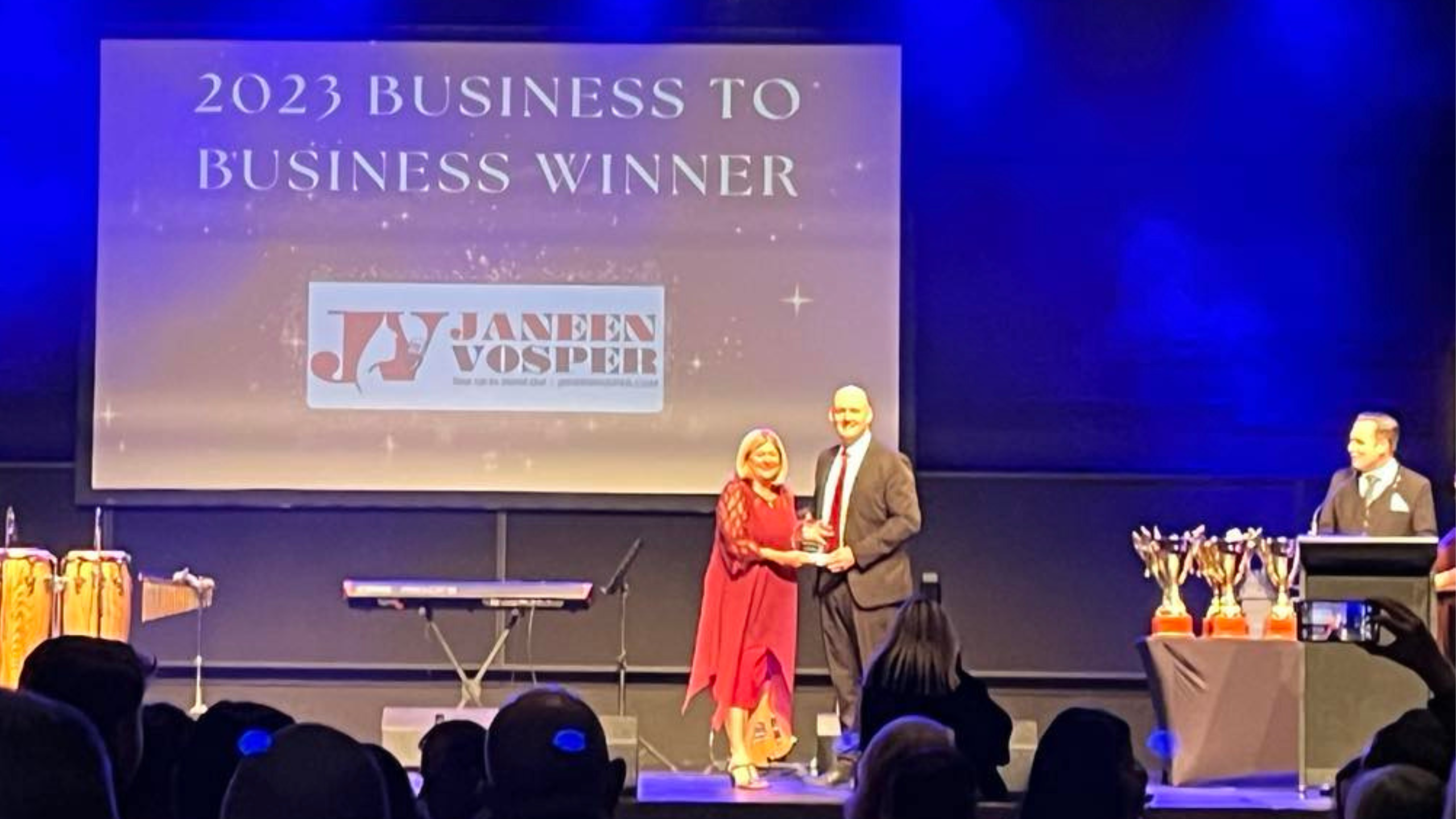 Janeen Vosper collecting an award for Logan small business of the year business to business catagory 2023